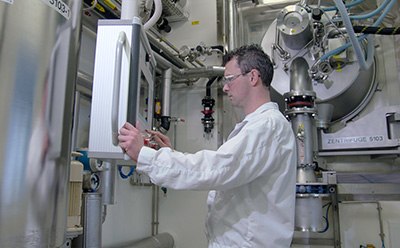 Schaffhausen, CH Scientist working with machinery in a lab