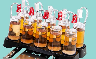 Fold the canister tubing over and insert the ends onto the vents of the canisters. Fold the canister tubing over and insert the ends onto the vents of the canisters.