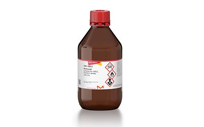Methanol The image is of a a brown plastic bottle with a red cap and a white label, which contains Methanol.