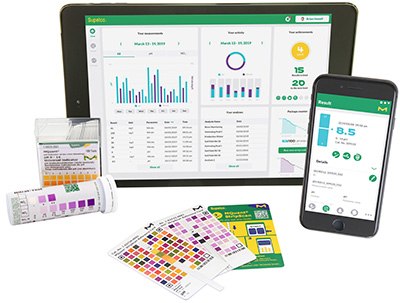 MQuant® StripScan App for Digital Readout of MQuant® Test Strips A digital tablet and a smartphone displaying pH measurement and analysis applications, alongside physical pH indicator strips and color charts. The tablet screen shows detailed graphs and statistics, while the smartphone displays a pH reading of 8.5 with a user interface for pH data. The setup illustrates the integration of traditional pH testing methods with modern digital technology for comprehensive analysis.