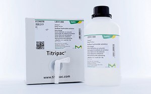 Titripac® packaging for volumetric solutions White bottle with black cap and green/yellow Supelco® branding and white packaging box of Titripac® titration reagent shown. Box has white L-shaped dispenser cap attached.