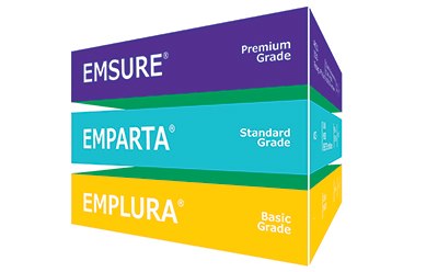 EMSURE® AND EMPLURA® INORGANIC REAGENTS The image displays a stack of three boxes, each labeled with different grades of chemical products. The top box is purple with “EMSURE® premium Grade,” the middle box is teal with “EMPARTA® Standard Grade,” and the bottom box is orange with “EMPLURA® Basic Grade.”