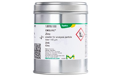 Metals for Pharmacopoeia Analysis The image features a container of EMSURE® Zinc powder, suitable for analysis with a particle size under 45 µm. The label includes a barcode, hazard symbols, and the brand “Supelco,” indicating the chemical’s properties and safety information.