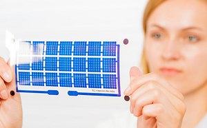 Printed Electronic Materials Printed electronic device held by a researcher.