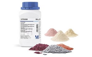 Microbial Culture Media Bottle with piles of microbial culture media
