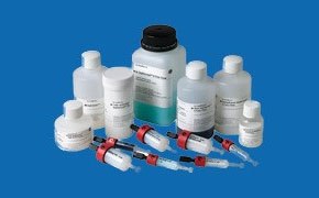 An array of Cytiva™ bioprocess products displayed against a blue background. The collection includes several white plastic bottles with labels and red-capped syringes. An array of Cytiva™ bioprocess products displayed against a blue background. The collection includes several white plastic bottles with labels and red-capped syringes.