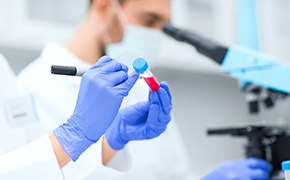 Laboratory labels Laboratory worker filling out a label on a test tube