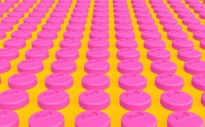Rows of pink tablets representing a manufacturing environment. Rows of pink tablets representing a manufacturing environment.