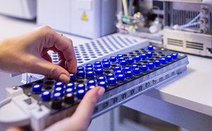Analytical chemistry Scientist holding an HPLC chromatogram