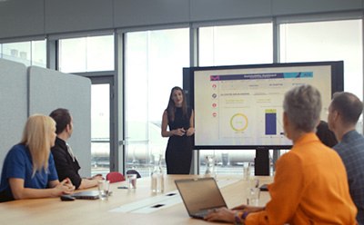 Customer meeting looking at graphs together Customer meeting looking at graphs together