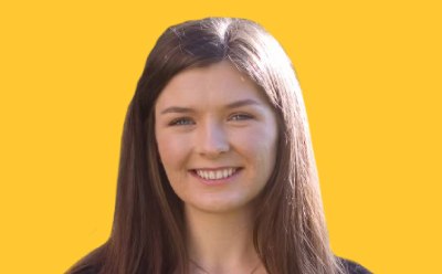 Amber Cook: Amber Cook headshot on yellow background