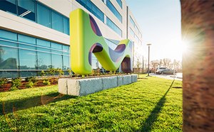 M sign in front of building Big M in front of building