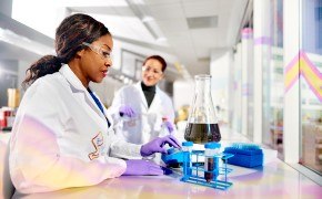 Chemical Compatibility Testing Scientist at bench performing qualification testing