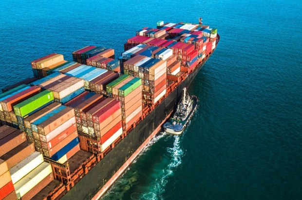 We launched our Mode Shift project in 2023, switching over 150 trade lanes from air to sea freight across six major distribution centers worldwide. A large container ship in the water.