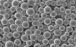 Close-up grayscale of numerous spherical microspheres with a smooth surface, varying slightly in size and densely packed together, representing API-loaded PLGA (poly(lactic-co-glycolic acid)) microspheres used in pharmaceutical applications for controlled drug release.  Close-up grayscale of numerous spherical microspheres with a smooth surface, varying slightly in size and densely packed together, representing API-loaded PLGA (poly(lactic-co-glycolic acid)) microspheres used in pharmaceutical applications for controlled drug release.