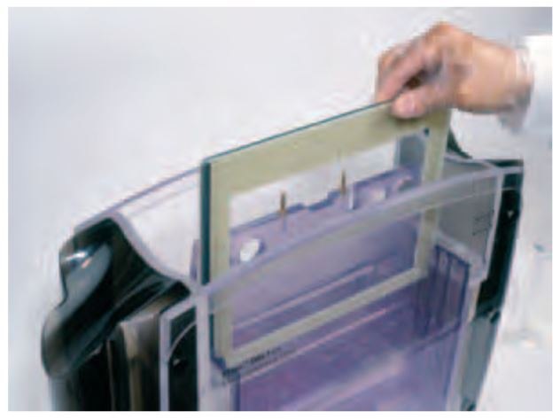 Inserting the cassettes into the cassette carrier. Inserting the cassettes into the cassette carrier
