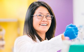 <p>Improved Karl Fischer Titration Analyses & Regulatory Compliance</p>
 Woman laboratory technician with PPE holding an Erlenmeyer
